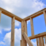 Exterior,Wall,Framing,Intersecting,With,Blue,Clouded,Sky,On,The