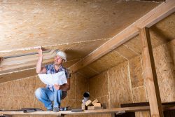 Male,Construction,Worker,Builder,Wearing,White,Hard,Hat,Crouching,On