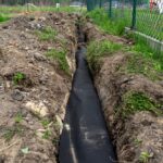 Drainage,Pipe,Wrapped,In,Geotextile,,Inserted,Into,A,Ditch,Dug
